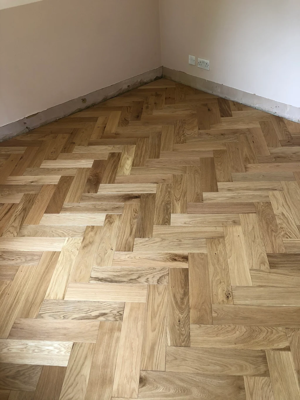 Herringbone flooring fitted by Paul Kimble Flooring
